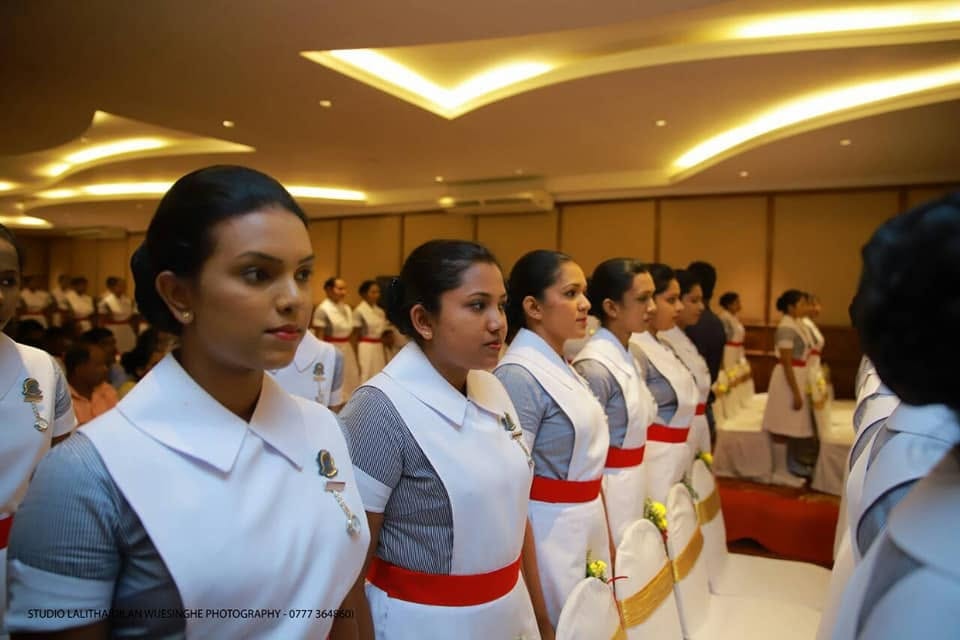 Nursing ceremony in Sri Lanka — nurses in formal uniform standing in rows
